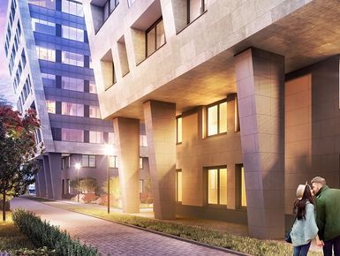 Фасад облицован натуральным камнем и панелями из архитектурной терракоты.