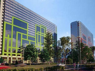 Два футуристических корпуса отличаются яркими фасадами со сплошным остеклением на верхних этажах.